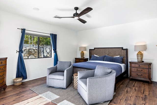 bedroom featuring ceiling fan and dark wood-type flooring