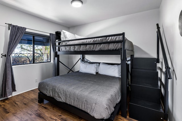 bedroom featuring dark hardwood / wood-style flooring