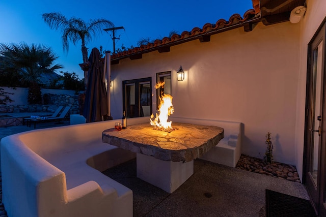 view of patio featuring an outdoor fire pit