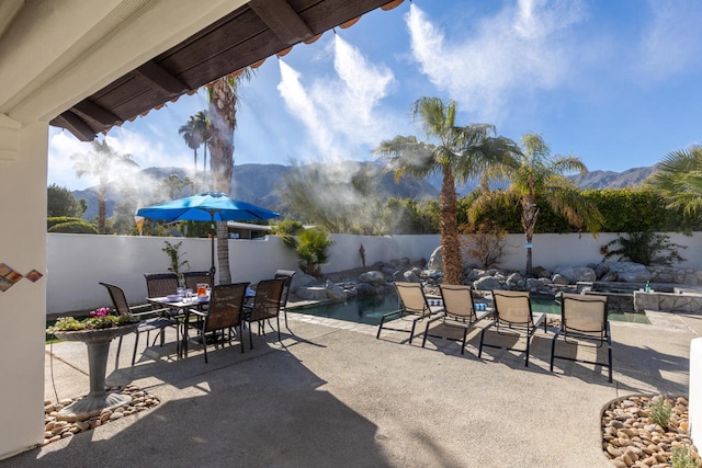 view of patio / terrace with a mountain view