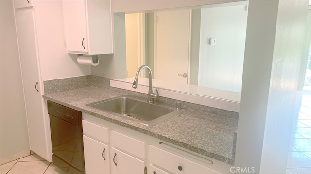 kitchen with light tile patterned flooring, dishwasher, sink, and white cabinets