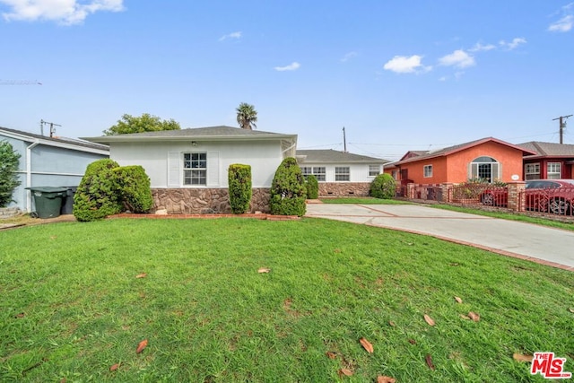 ranch-style home with a front yard