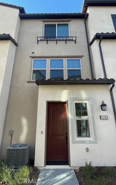 doorway to property featuring central AC