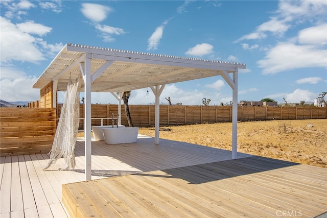 wooden deck featuring a pergola