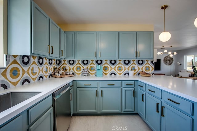 kitchen featuring kitchen peninsula, pendant lighting, decorative backsplash, and dishwasher