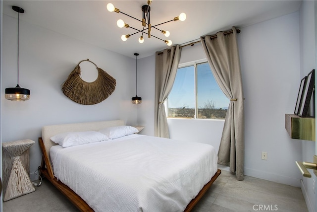 bedroom with a notable chandelier