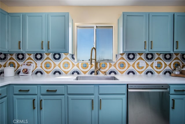 kitchen featuring sink, blue cabinetry, backsplash, and dishwasher