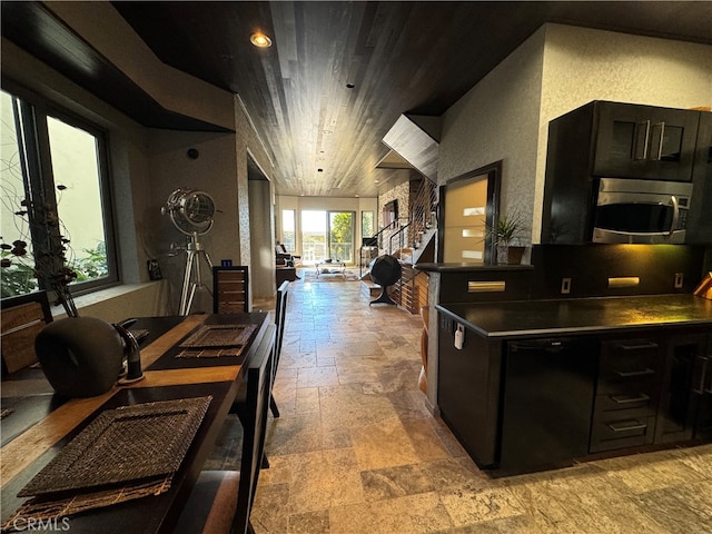 kitchen with black dishwasher and wooden ceiling