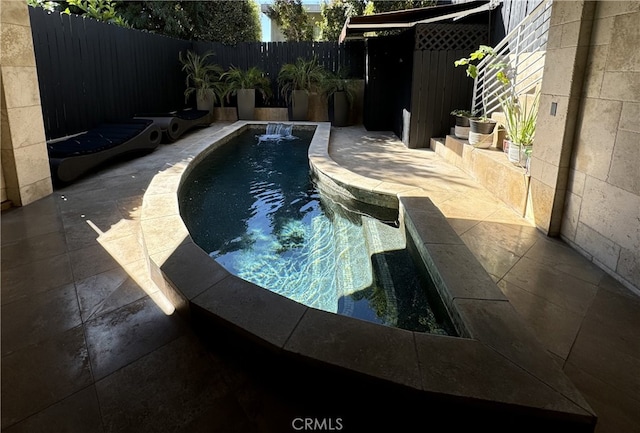 view of pool featuring a patio area and pool water feature