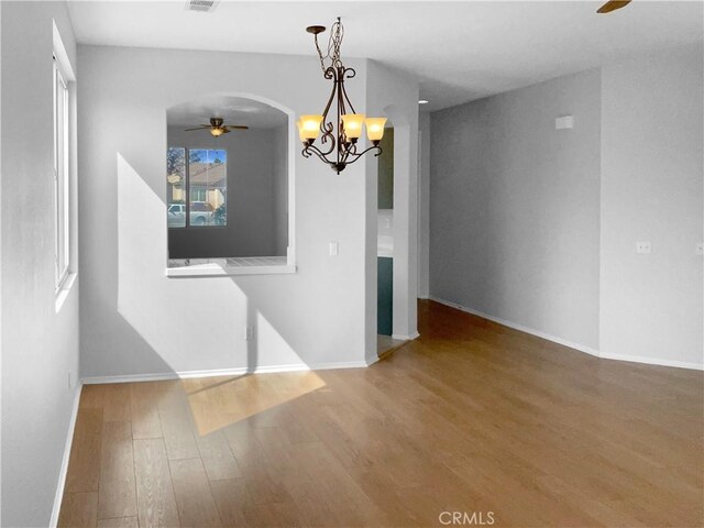 unfurnished dining area with wood-type flooring and ceiling fan