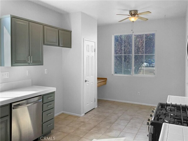 kitchen featuring light tile patterned floors, stainless steel appliances, and ceiling fan