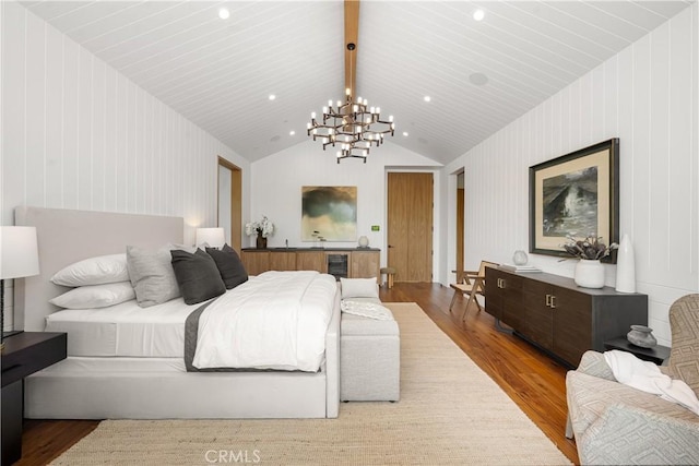 bedroom featuring wood-type flooring, vaulted ceiling with beams, an inviting chandelier, and wine cooler