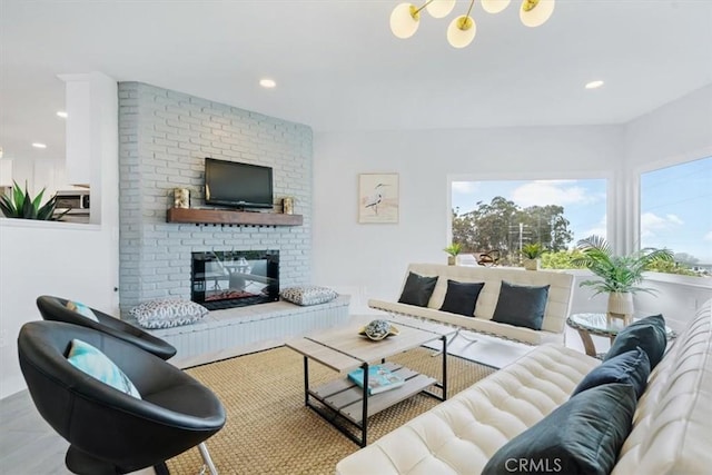 living room featuring a brick fireplace