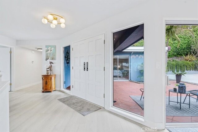 entrance foyer with light wood-type flooring