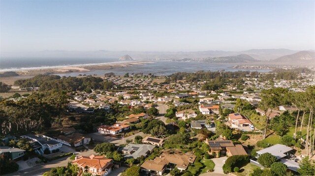 bird's eye view with a water and mountain view