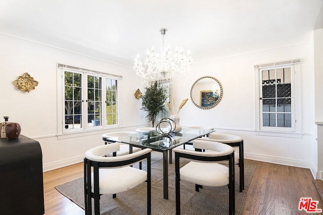 dining room with a chandelier and hardwood / wood-style flooring