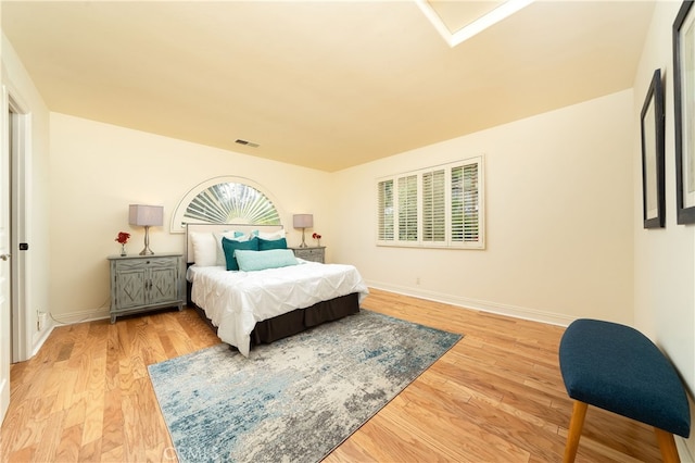 bedroom with light hardwood / wood-style floors