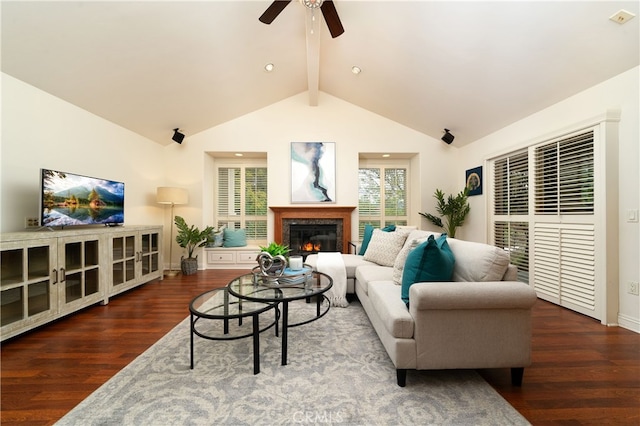 living room with dark wood-type flooring, vaulted ceiling with beams, and ceiling fan