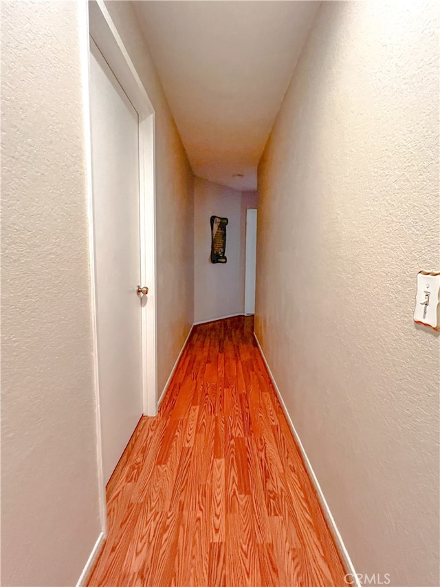 corridor featuring light wood-type flooring