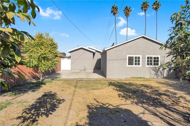 back of property featuring a patio