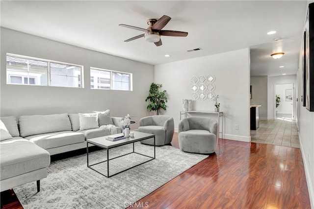 living room with ceiling fan and hardwood / wood-style floors