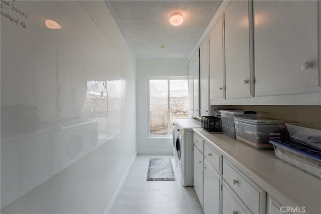 laundry room with a textured ceiling