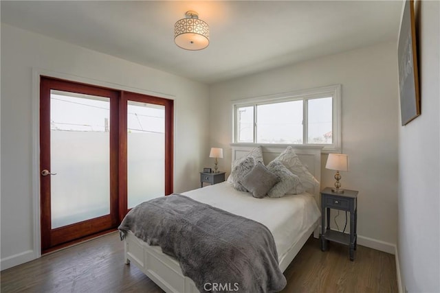 bedroom featuring dark hardwood / wood-style flooring