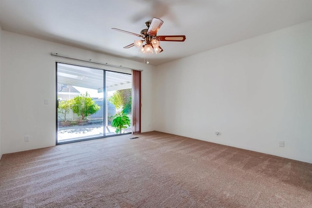 unfurnished room with carpet and ceiling fan