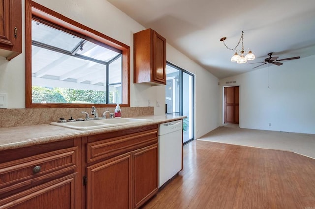 kitchen featuring decorative light fixtures, light hardwood / wood-style floors, sink, white dishwasher, and ceiling fan with notable chandelier