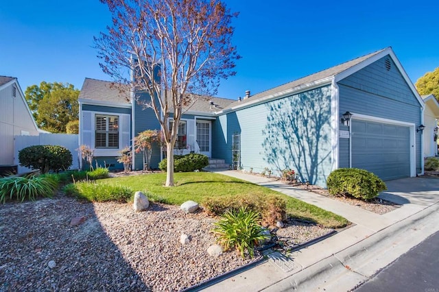 single story home with a front yard and a garage