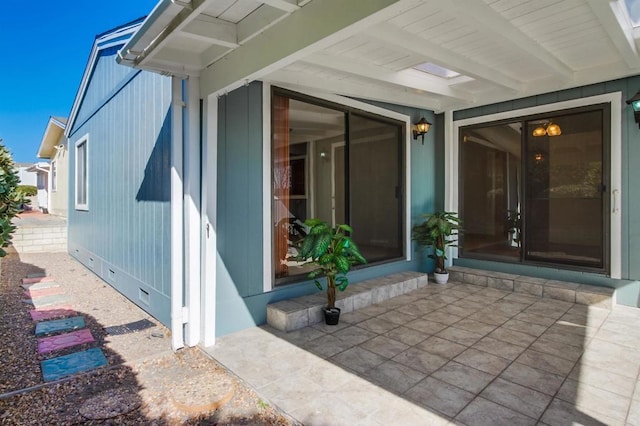 doorway to property featuring a patio