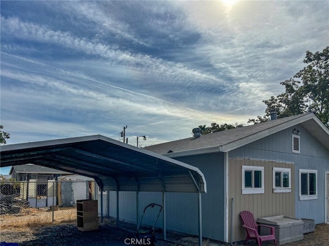 exterior space with a carport