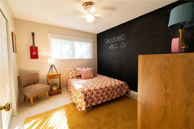 bedroom featuring a textured ceiling and ceiling fan