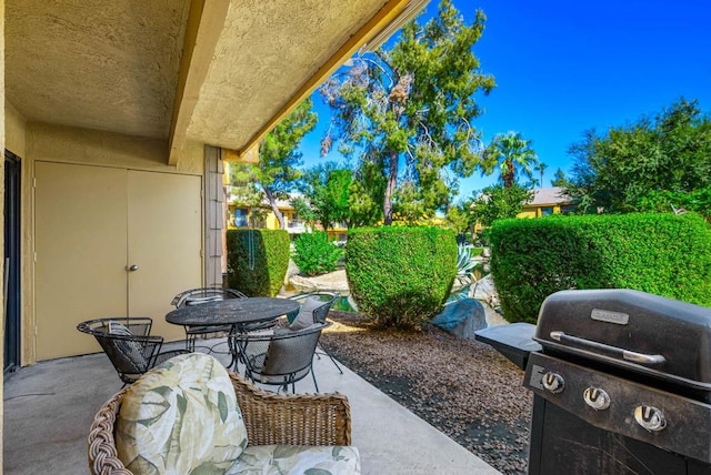 view of patio with a grill