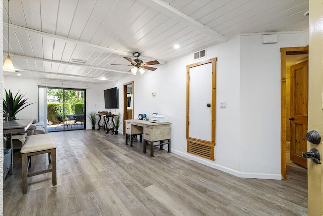 interior space featuring beamed ceiling, hardwood / wood-style flooring, ceiling fan, and wood ceiling