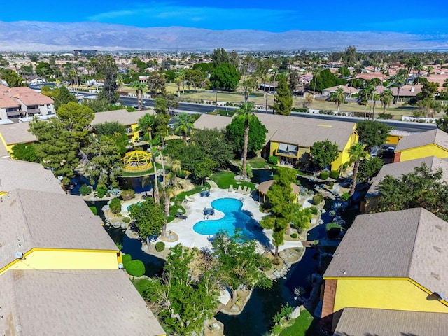 birds eye view of property with a mountain view