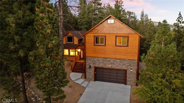 log cabin featuring a garage