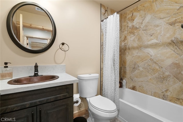 bathroom with shower / bath combo with shower curtain, toilet, and vanity