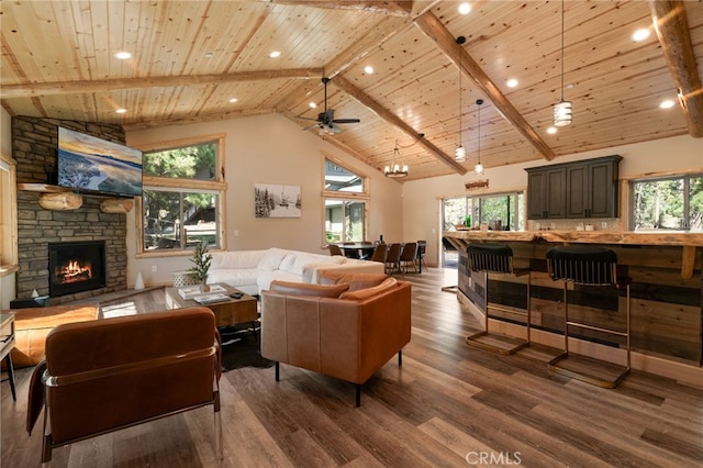 living room featuring high vaulted ceiling, a wealth of natural light, and dark hardwood / wood-style flooring