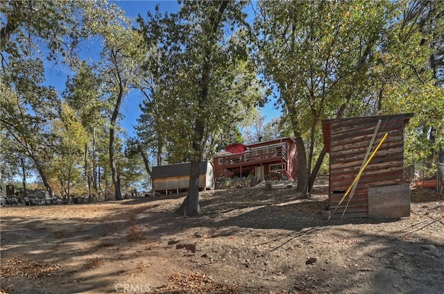 view of yard featuring a wooden deck