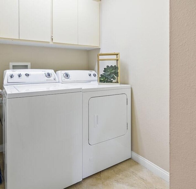 laundry area featuring cabinets and separate washer and dryer