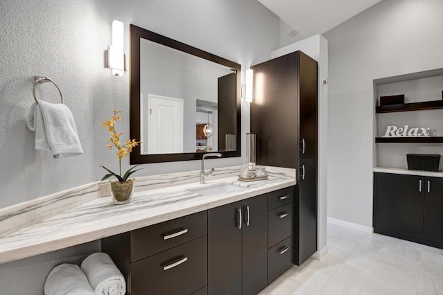 bathroom featuring tile patterned flooring and vanity