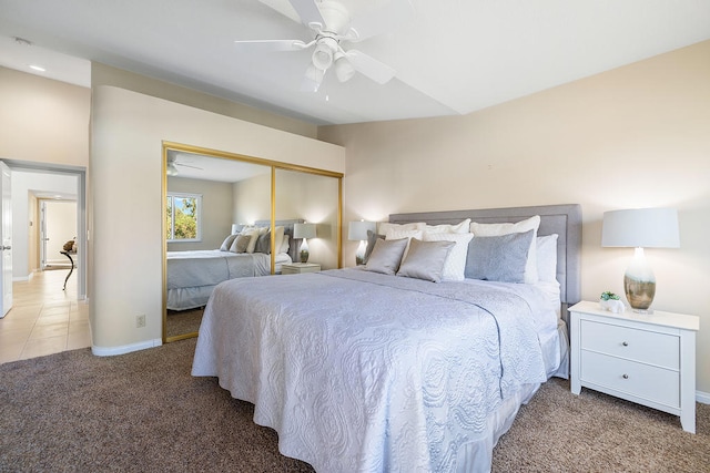 carpeted bedroom with a closet and ceiling fan