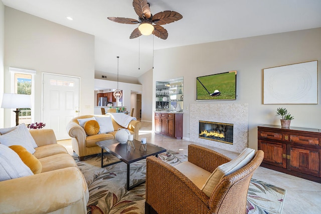 living room featuring ceiling fan and high vaulted ceiling