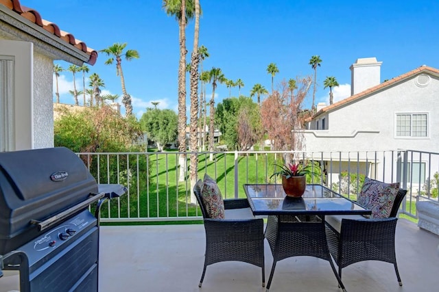 view of patio / terrace with a balcony and grilling area