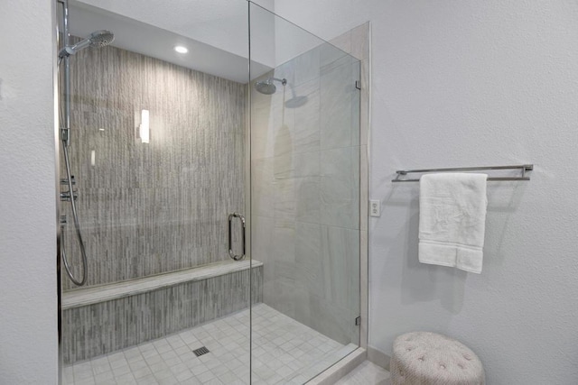 bathroom with a shower with shower door