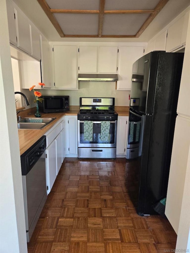 kitchen with black appliances, dark parquet floors, sink, and white cabinets