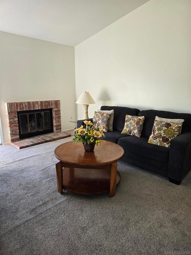 living room featuring a brick fireplace and carpet flooring