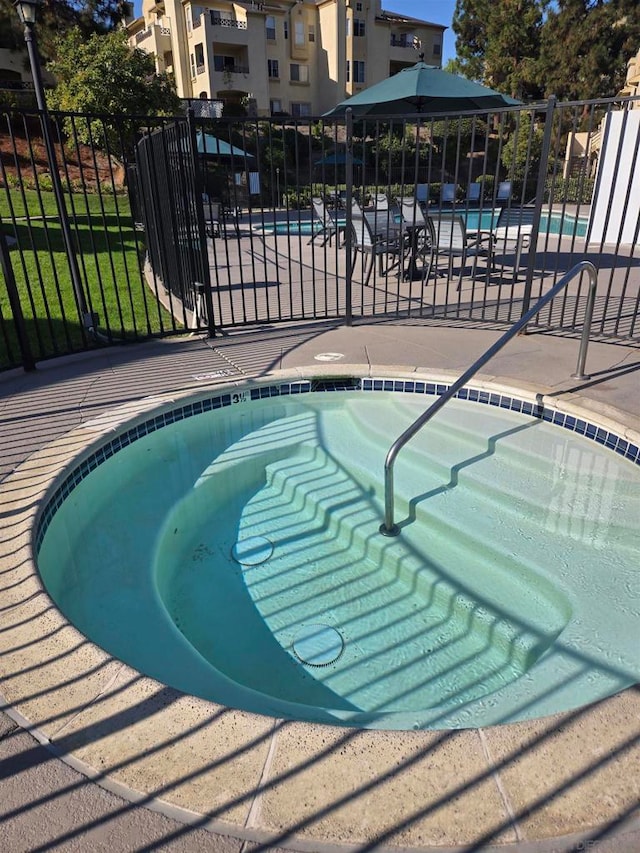 view of swimming pool with a patio