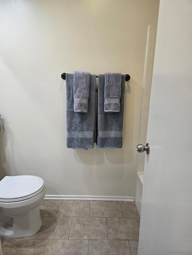 bathroom with tile patterned floors, toilet, and plus walk in shower